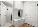 Charming mudroom with built-in storage, bench, and coat hooks near the door at 9833 Ardley Park Way, Mint Hill, NC 28227