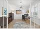 Stylish office featuring hardwood floors, a modern chandelier, and bright natural light perfect for productivity at 9833 Ardley Park Way, Mint Hill, NC 28227