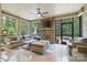 Cozy screened porch with a stone fireplace and comfortable seating, perfect for outdoor relaxation at 9833 Ardley Park Way, Mint Hill, NC 28227