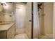 Cozy bathroom featuring a shower and sink with decorative tile at 1010 Forest Dr, Lancaster, SC 29720