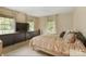 Serene bedroom with large windows, neutral tones, and ample closet space at 1010 Forest Dr, Lancaster, SC 29720