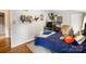 This bedroom offers plenty of space, warm wood floors, and a neutral color palette at 1010 Forest Dr, Lancaster, SC 29720