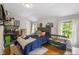 This bedroom offers warm, natural light and hardwood floors at 1010 Forest Dr, Lancaster, SC 29720