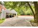 Attached carport provides covered parking and storage solutions; convenient and practical space at 1010 Forest Dr, Lancaster, SC 29720