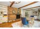 Dining area with brick fireplace and hardwood floors offering a cozy atmosphere at 1010 Forest Dr, Lancaster, SC 29720
