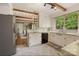 Bright kitchen featuring white cabinets, modern appliances, and wooden beams at 1010 Forest Dr, Lancaster, SC 29720