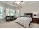 A bedroom with a ceiling fan, a bed, and large windows at 1032 Seminole Dr, Waxhaw, NC 28173