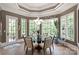 Bright dining area with large windows, tile floors, modern lighting, and views of the surrounding greenery at 1032 Seminole Dr, Waxhaw, NC 28173