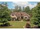 Beautiful house with well-maintained lawn, stone accents and professionally landscaped yard at 1032 Seminole Dr, Waxhaw, NC 28173