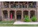 The home's exterior with stone archways, a patio, and manicured landscaping at 1032 Seminole Dr, Waxhaw, NC 28173