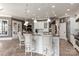 A kitchen with a large island and breakfast bar, with seating for three at 1032 Seminole Dr, Waxhaw, NC 28173