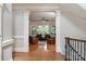 Living room showcasing hardwood floors, columns, and bright lighting from the many windows at 1032 Seminole Dr, Waxhaw, NC 28173