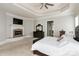 Tranquil primary bedroom features a cozy fireplace, sitting area, and neutral tones at 1032 Seminole Dr, Waxhaw, NC 28173