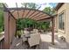 Outdoor dining space on a deck with pergola, perfect for entertaining at 1032 Seminole Dr, Waxhaw, NC 28173