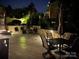 Outdoor patio features stone retaining wall, patio furniture and elegant hardscape at 1032 Seminole Dr, Waxhaw, NC 28173