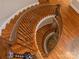 Overhead shot of a curved staircase with hardwood treads and decorative metal at 1032 Seminole Dr, Waxhaw, NC 28173