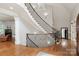 Elegant curved staircase with iron spindles and hardwood treads at 1032 Seminole Dr, Waxhaw, NC 28173