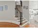 Staircase with hardwood steps and wrought iron balusters, leading to the upper level at 1032 Seminole Dr, Waxhaw, NC 28173