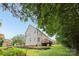 The expansive backyard features a lush lawn, a wooden deck and a garden at 11103 Fountaingrove Dr, Charlotte, NC 28262
