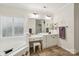 Bright bathroom with double vanity, decorative accents, large mirror, and a soaking tub at 11103 Fountaingrove Dr, Charlotte, NC 28262