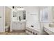 Bright bathroom featuring a soaking tub, vanity with ample cabinet storage, and modern fixtures at 11103 Fountaingrove Dr, Charlotte, NC 28262