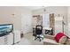 Bright bedroom with a work desk, floral curtains, and white storage unit at 11103 Fountaingrove Dr, Charlotte, NC 28262