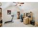 Bedroom featuring a ceiling fan, a vaulted ceiling, a treadmill, a bookshelf, and a work desk at 11103 Fountaingrove Dr, Charlotte, NC 28262