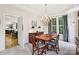 Formal dining room has natural light, wood floors, and classic furnishings at 11103 Fountaingrove Dr, Charlotte, NC 28262
