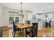 Bright kitchen features a breakfast nook, stainless steel appliances, and hardwood floors at 11103 Fountaingrove Dr, Charlotte, NC 28262