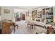 Spacious living room featuring built-in bookshelves, hardwood accents, and views into the dining room at 11103 Fountaingrove Dr, Charlotte, NC 28262
