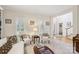 Inviting living room showcasing bright natural light and a view through to the entryway and staircase at 11103 Fountaingrove Dr, Charlotte, NC 28262