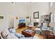 Comfortable living room with high ceiling, fireplace, built-ins, and stylish decor and furnishings at 11103 Fountaingrove Dr, Charlotte, NC 28262
