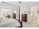 Spacious main bedroom featuring a four-poster bed and a work desk at 11103 Fountaingrove Dr, Charlotte, NC 28262