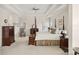 Spacious main bedroom with tray ceiling, four-poster bed, and dual windows at 11103 Fountaingrove Dr, Charlotte, NC 28262