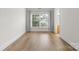 Empty bedroom with hardwood floors, natural light, and neutral paint at 1123 Market St, Fort Mill, SC 29708