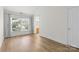 Bright, empty bedroom featuring neutral paint, hardwood floors, and natural light at 1123 Market St, Fort Mill, SC 29708