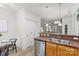 Kitchen with stainless steel appliances and view into adjacent living spaces at 1123 Market St, Fort Mill, SC 29708