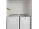 A laundry room with a white dryer and washing machine, featuring a hanging rod at 1123 Market St, Fort Mill, SC 29708