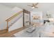 Inviting living room featuring hardwood floors, a cozy fireplace, and open staircase at 1123 Market St, Fort Mill, SC 29708