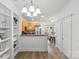 Bright living area with hardwood floors, connects the living room to the kitchen and dining area at 1123 Market St, Fort Mill, SC 29708