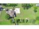 Aerial view of a home, showcasing a spacious lot, pool, and surrounding greenery at 141 Weathers Creek Rd, Troutman, NC 28166