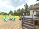 Backyard view featuring an outdoor lounge and large deck with trees in background at 141 Weathers Creek Rd, Troutman, NC 28166