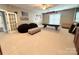 Finished basement with carpeting, ample space and a ping pong table at 141 Weathers Creek Rd, Troutman, NC 28166