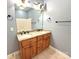 Bathroom featuring a double sink vanity with granite countertops and bronze hardware at 141 Weathers Creek Rd, Troutman, NC 28166
