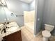 Bathroom showcasing a double sink vanity, granite countertops, and a shower at 141 Weathers Creek Rd, Troutman, NC 28166