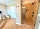 Modern bathroom featuring a glass-enclosed tiled shower and a commode at 141 Weathers Creek Rd, Troutman, NC 28166
