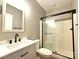 Updated bathroom with a sleek vanity, matte black hardware, and glass shower at 141 Weathers Creek Rd, Troutman, NC 28166