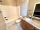 Full bathroom with updated vanity and granite counters with a shower and tub combo at 141 Weathers Creek Rd, Troutman, NC 28166