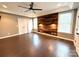 Inviting bedroom featuring a wood-paneled accent wall, ceiling fan, and natural light at 141 Weathers Creek Rd, Troutman, NC 28166