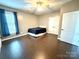 Bright bedroom with hardwood floors, a ceiling fan, and a double door closet at 141 Weathers Creek Rd, Troutman, NC 28166